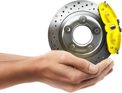 Hands holding disc brake with yellow caliper